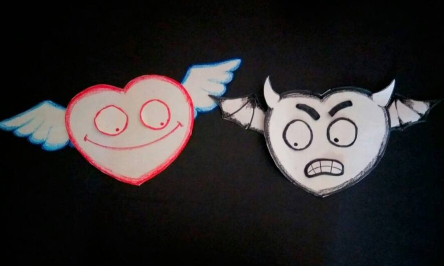 Two paper cut out hearts with wings, one with a happy face and the other with a frowny face.